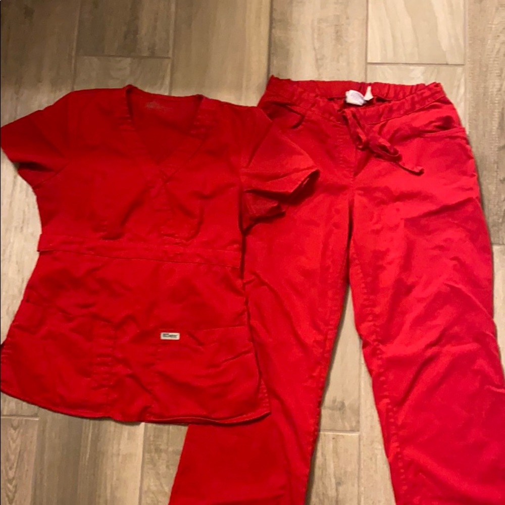 Gently used red greys anatomy scrubs. Size xsmall